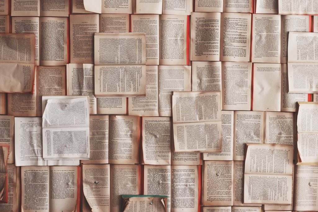 Dozens of books open facing up